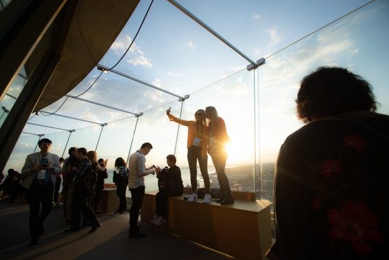 Tourists-Taking-Pictures-at-Seattle-Space-Needle-observation-deck
