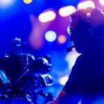 hybrid live stream corporate event seattle camera operator blue background