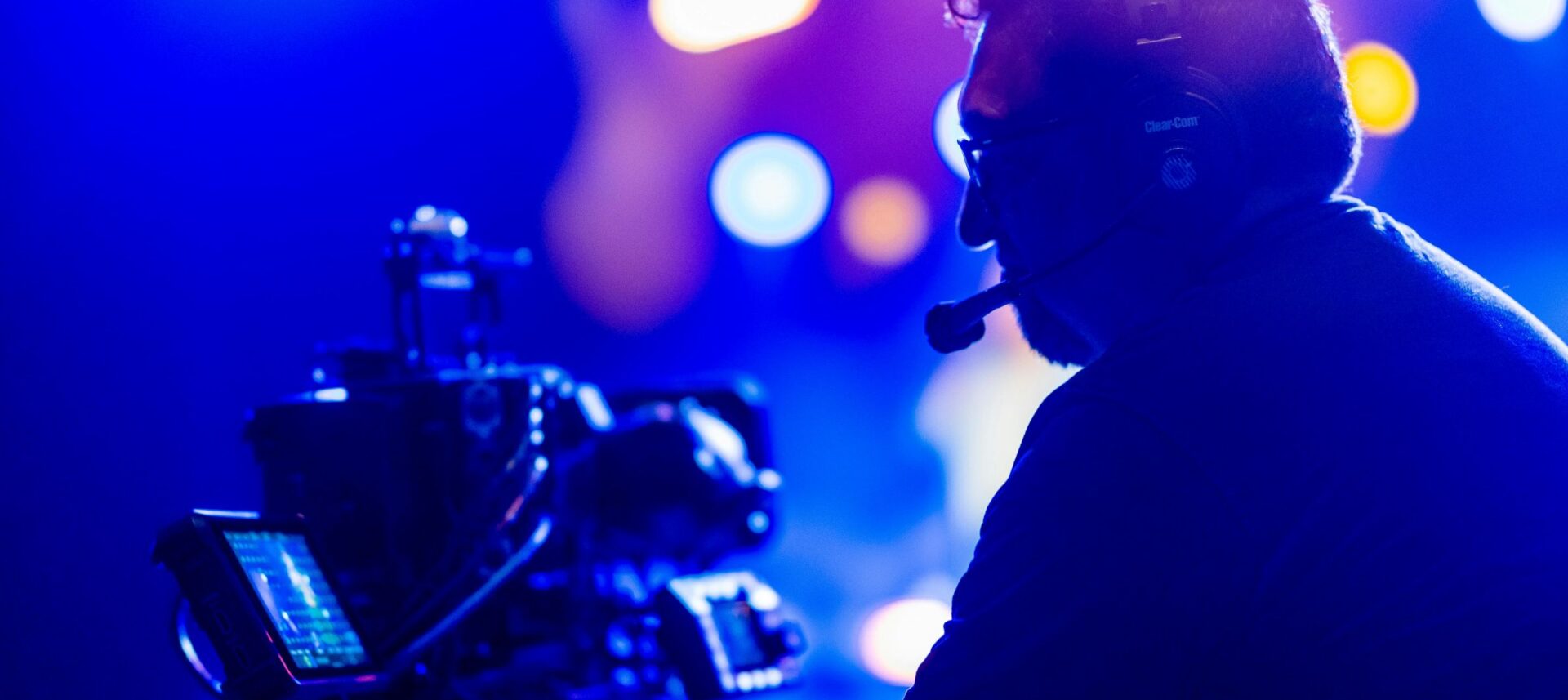 hybrid live stream corporate event seattle camera operator blue background