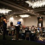 Seattle Corporate Event Auction Fundraiser Embassy Suites Ballroom Speaker at Podium