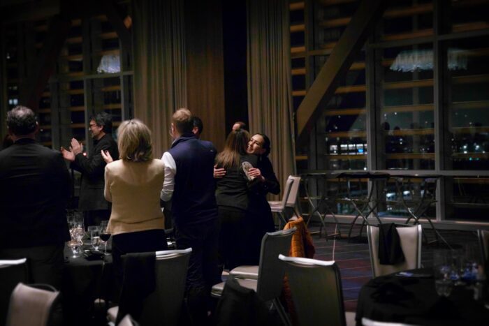 Seattle Corporate Event Auction Fundraiser Dinner Catering Embassy Suites Venue Clapping Hugs