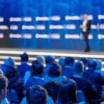 Keynote Guest Speaker Coordination Seattle Business Conference Stage Audience