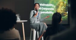 Business woman, speaker audience for conference, presentation and global seminar with microphone. International event, convention and networking for collaboration, speech and corporate sustainability CSR programs Seattle