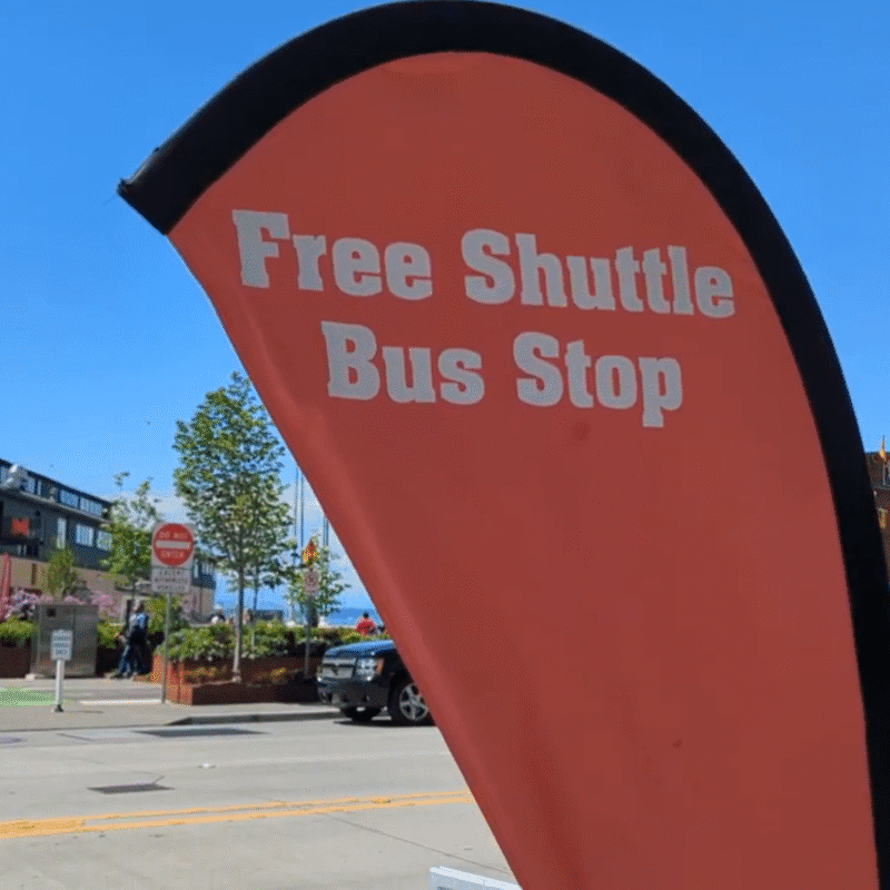 Seattle event transportation corporate shuttle service bus stop sign